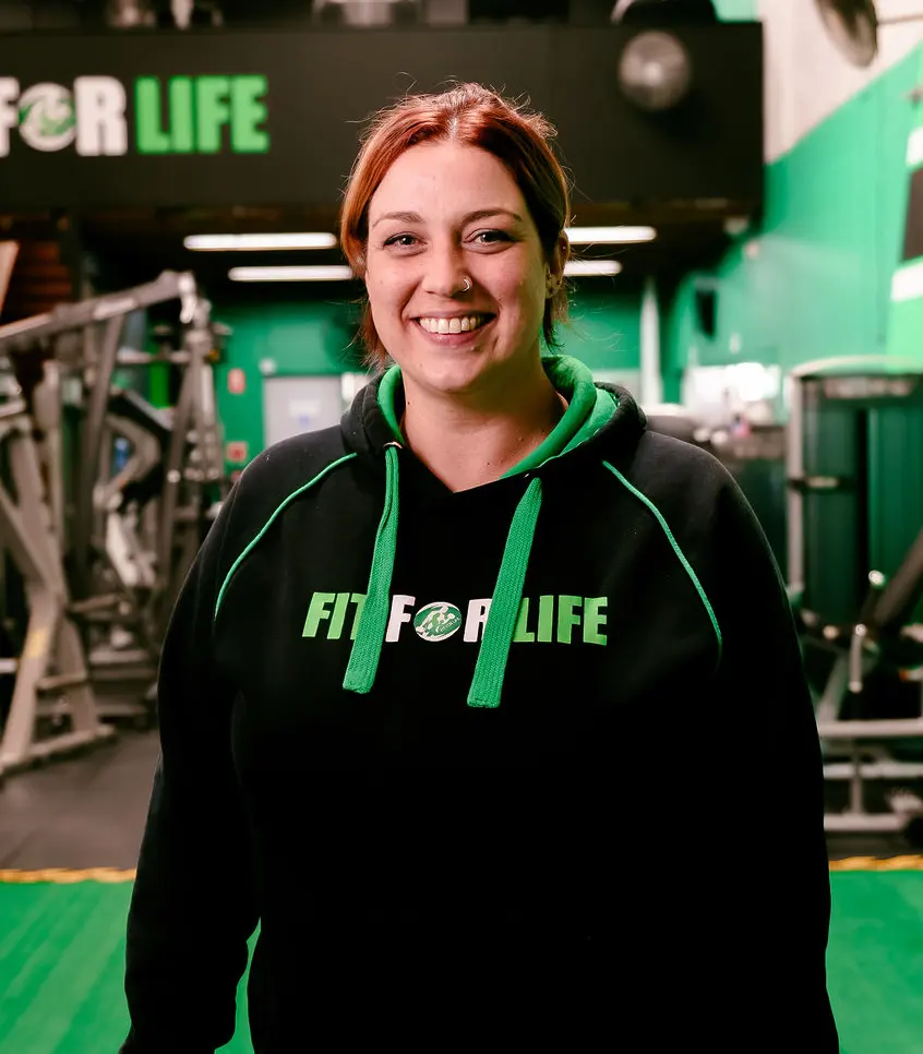 Claire, personal trainer at Fit For Life 24/7 Gym, smiling in the gym